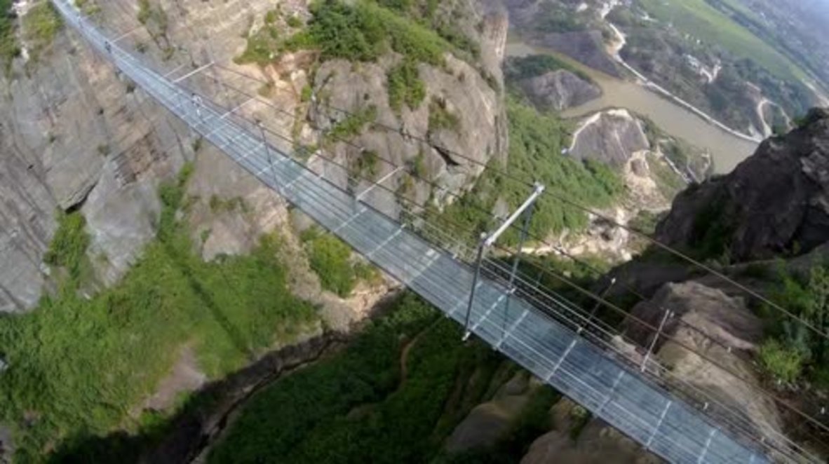 China: Drone captures world's longest GLASS suspension bridge
