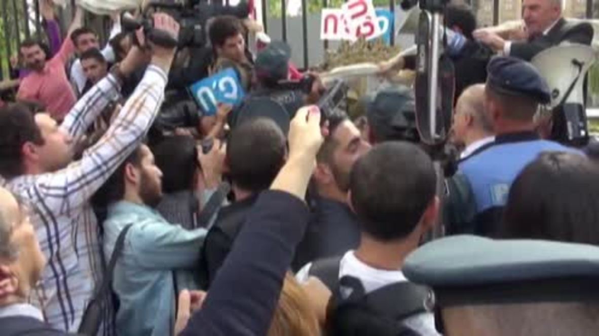 Armenia: Protesters and police scuffle outside parliament