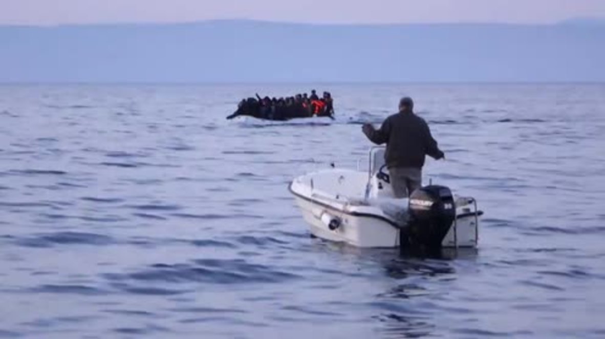 Greece: Local fishermen guide refugee boats to Lesbos as weather conditions worsen