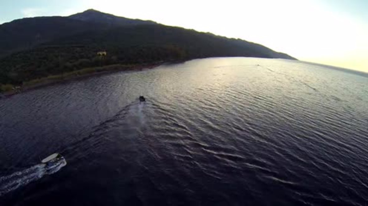 Greece: See DRONE footage of local fisherman guiding refugee boat to Lesbos