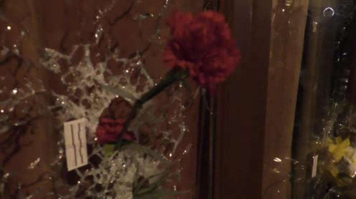 France: Flowers placed through bullet-holes at the cafes of Friday's terror