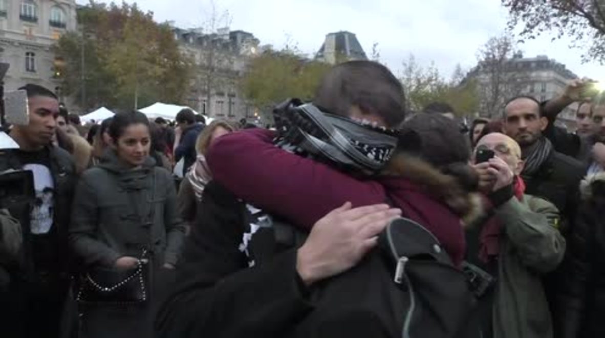 France: Blindfolded Muslim man hugs mourners in Paris