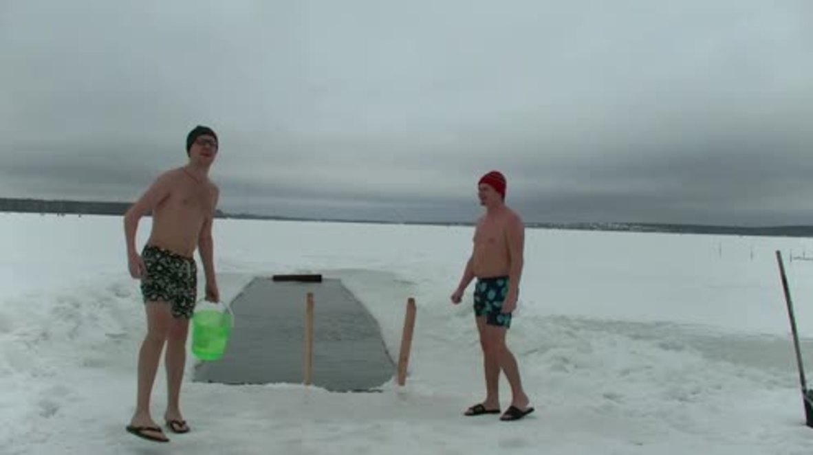 Russia: Watch as swimmers play chess in frozen lake near Yekaterinburg