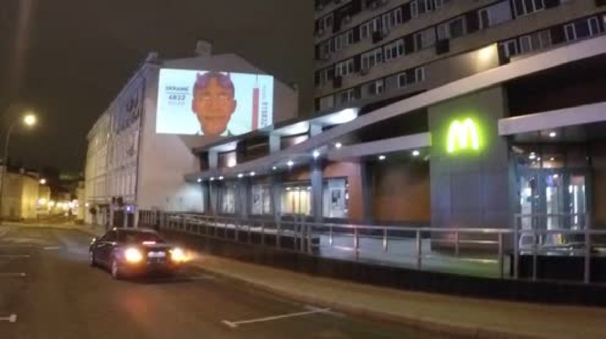Russia: 'Obama' with devil-horns projection devours flags of Iraq, Ukraine