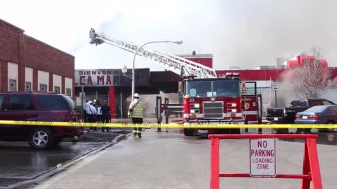 USA: Fire crews react after blaze engulfs Chicago flea market