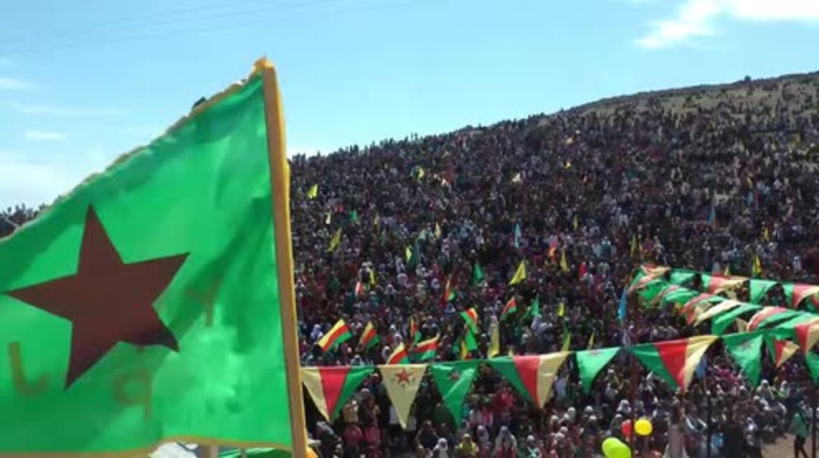 Syria: Thousands of Kurds celebrate Newroz on Mishtenur hill in Kobane