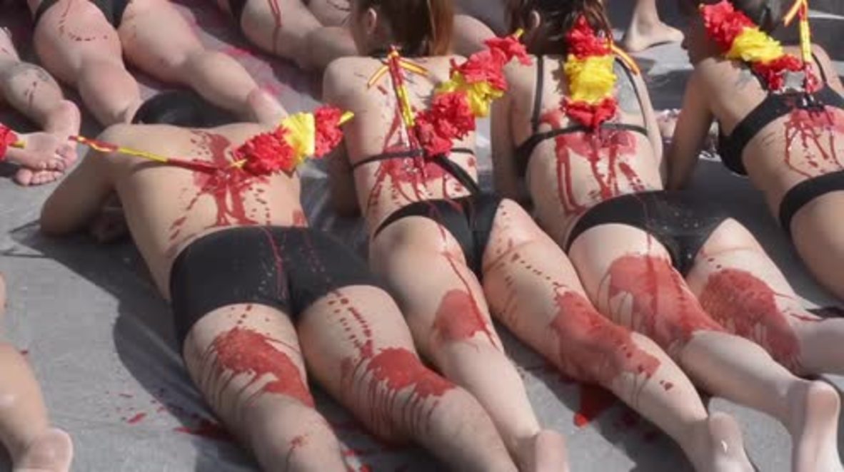 Spain: Blood-covered, bikini-clad protesters decry bullfighting as season kicks off