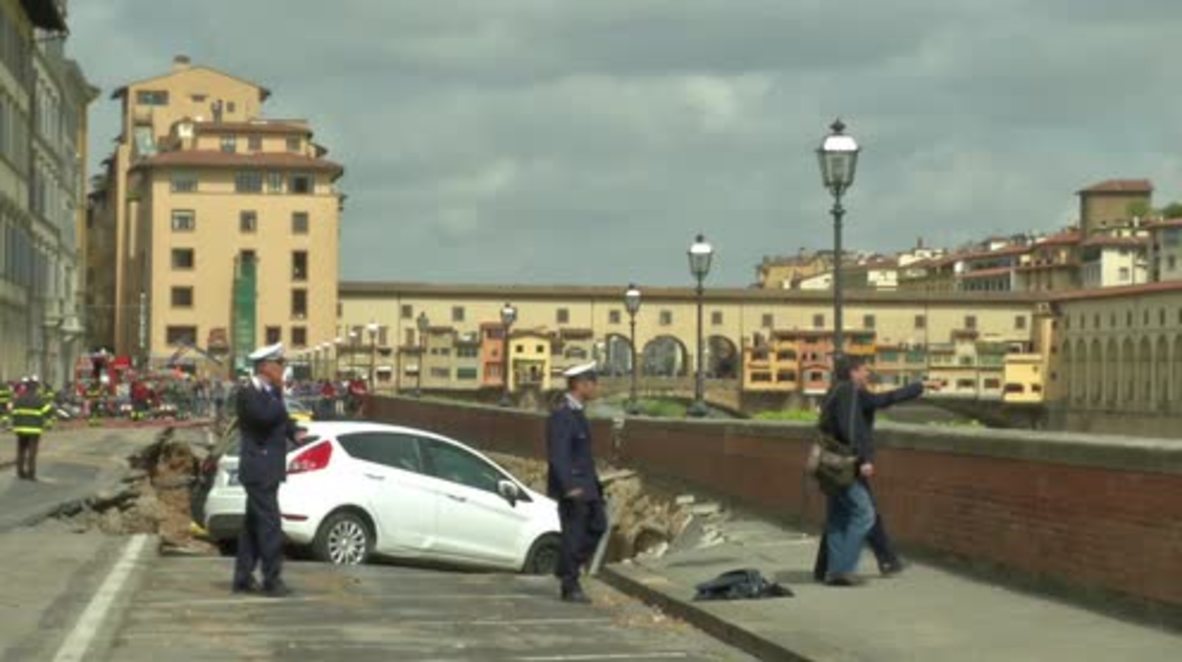 Italy: Massive sinkhole swallows TWENTY cars along Florence's Arno