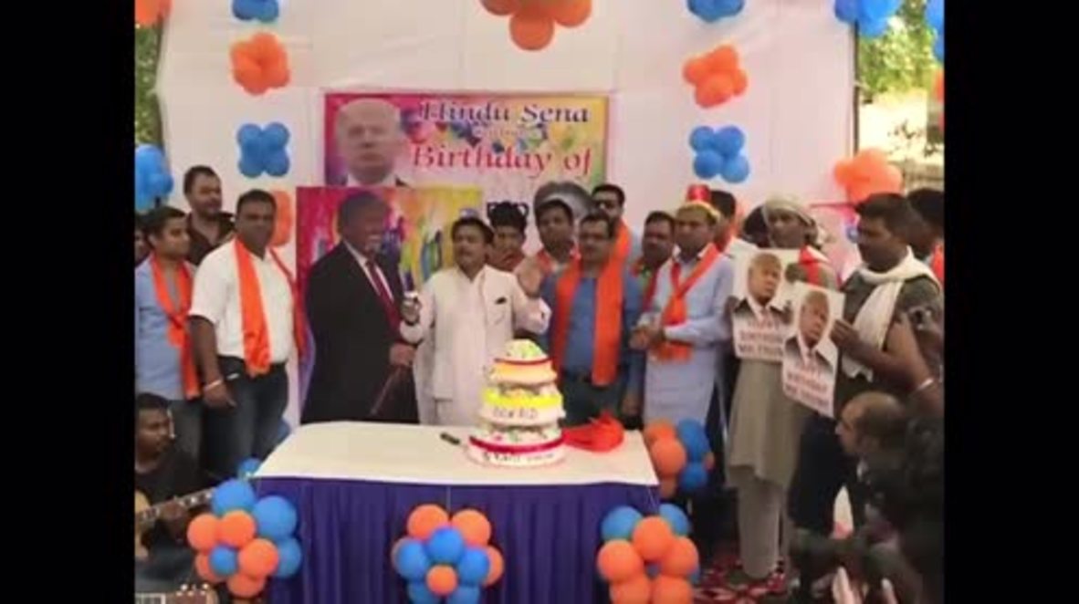 India: Hindu nationalist group celebrates Trump's birthday, feeds his portrait cake