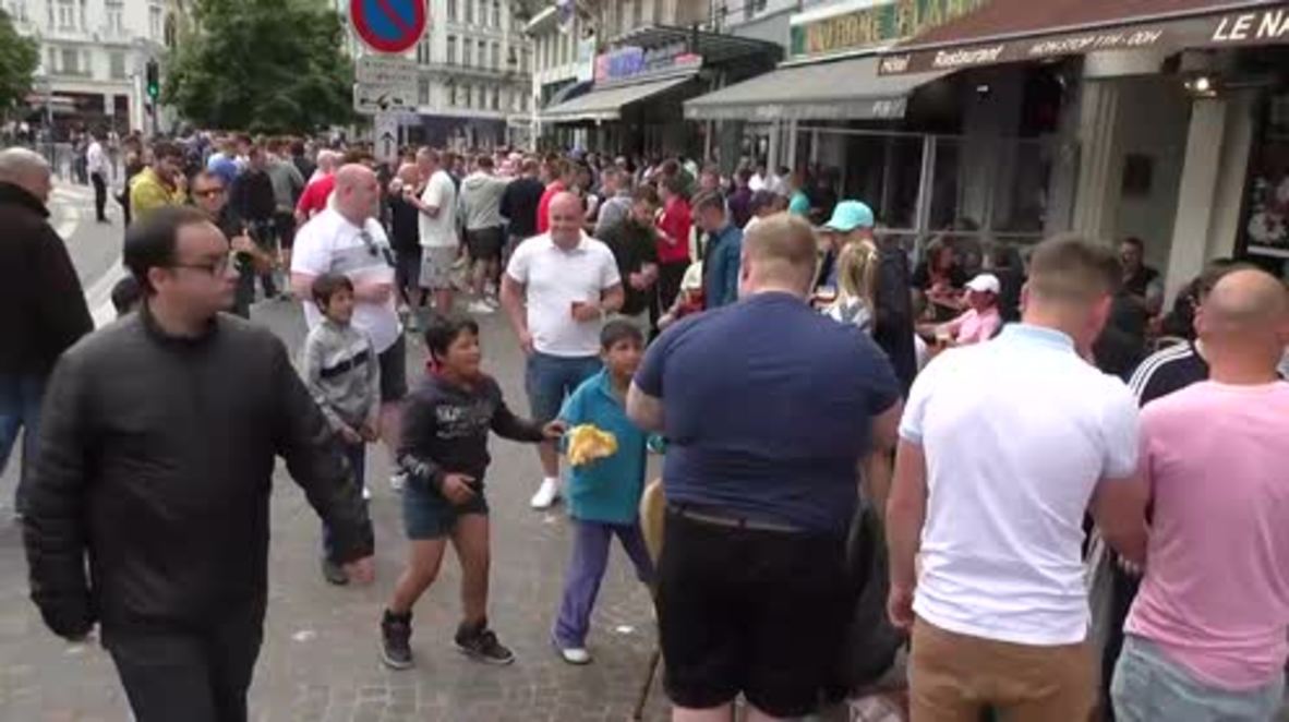 France: England fans laugh as they fling money at migrant children in Lille