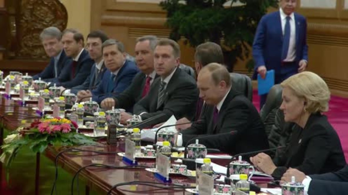 China: Putin and Russia's top officials talk cooperation with Xi Jinping