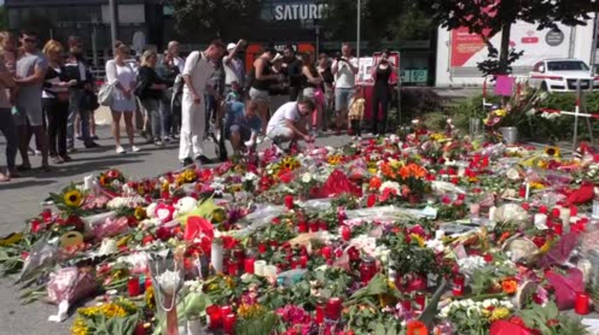 Germany: Munich residents mourn shooting victims with public vigil