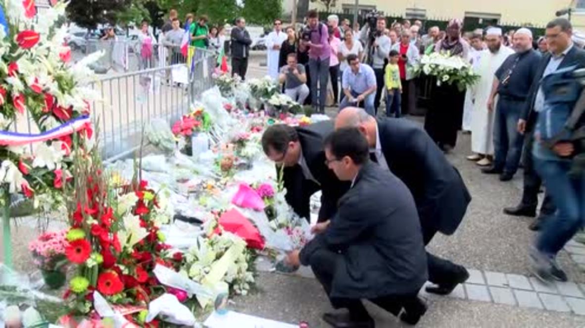France: Saint-Etienne-du-Rouvray's Muslim community lay flowers for slain priest