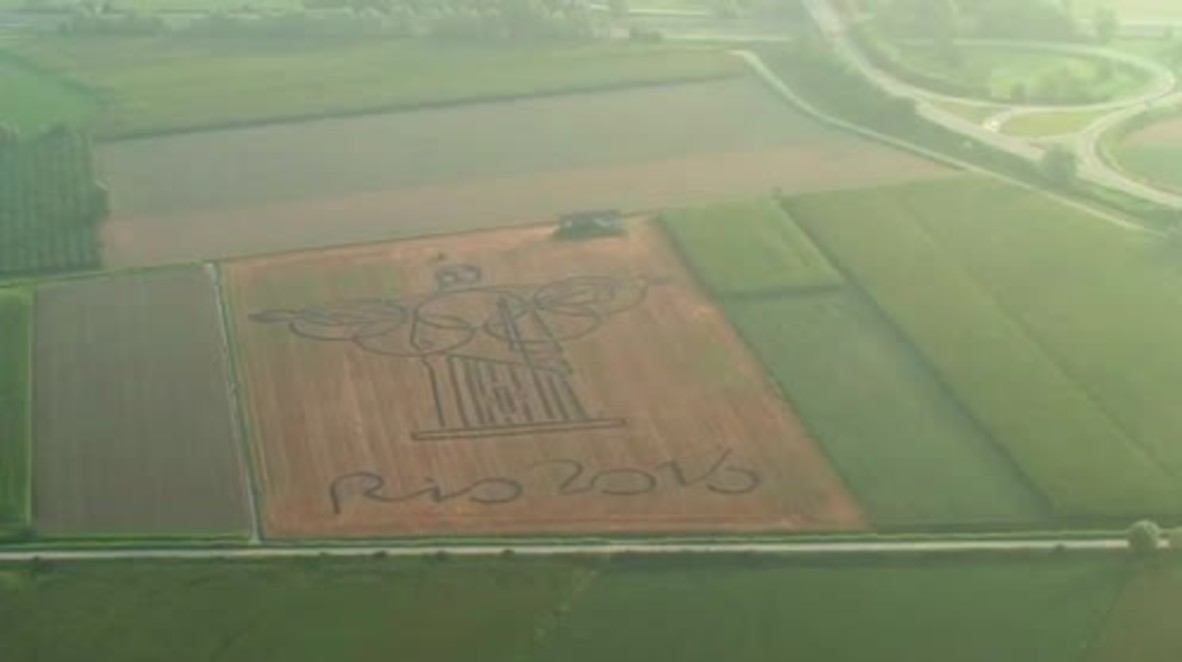 Italy: Land artist ploughs giant Olympics tribute with tractor
