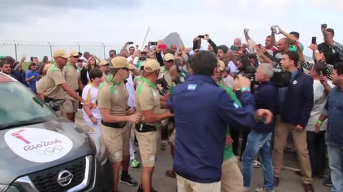 Brazil: Armoured police safeguard Rio Mayor on Olympic torch relay