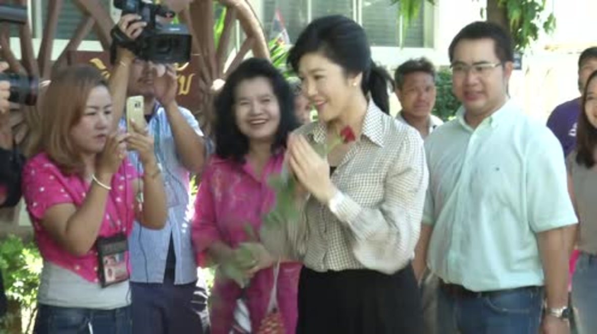 Thailand: Ousted PM Shinawatra votes as military-written constitution approved