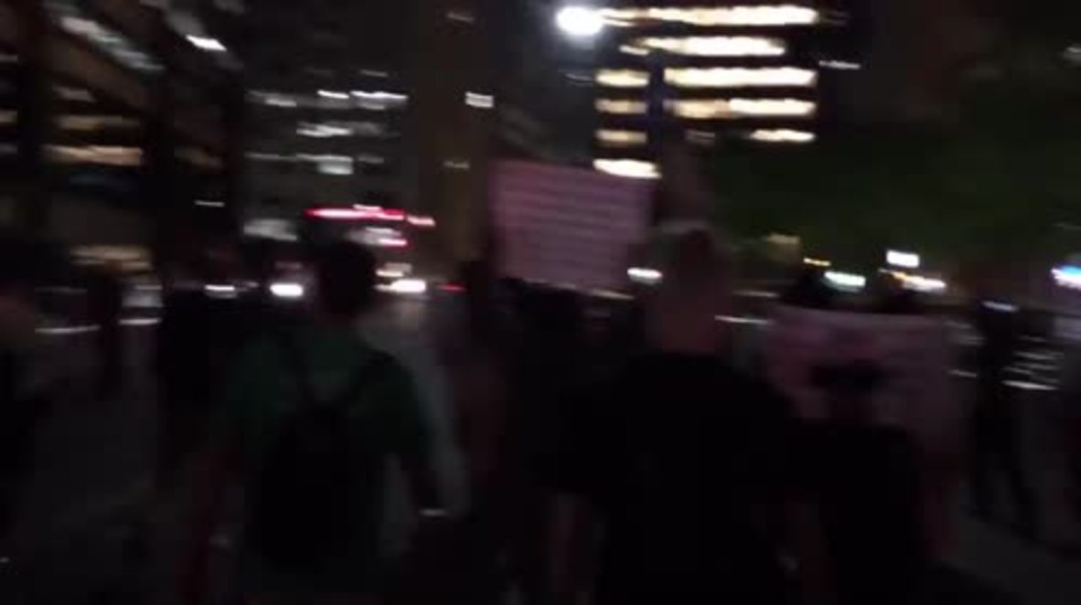 USA: Anti-brutality protesters storm NYC shopping centre