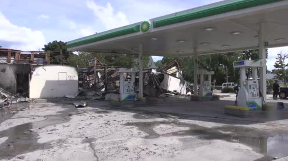 USA Dozens gather near burned gas station after violent protests in