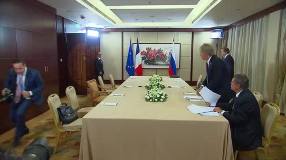China: Putin and Hollande talk Ukrainian and Syrian conflicts