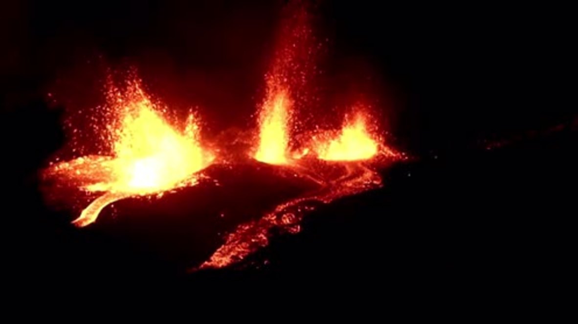 France: Piton de la Fournaise volcano spits lava into the night sky