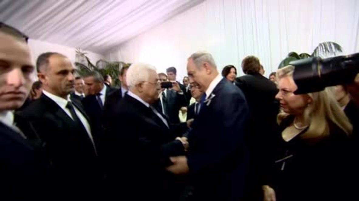 Israel: Abbas and Netanyahu exchange 'historic' hand shake at Peres funeral