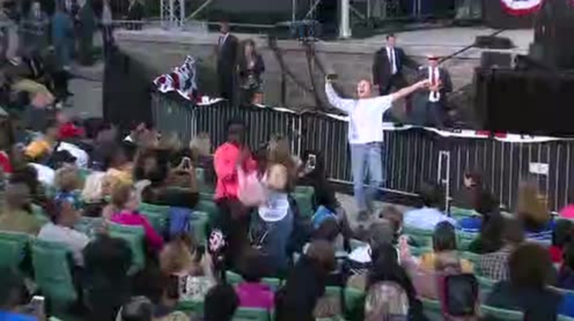 USA: Protesters wearing 'Bill Clinton's a Rapist' t-shirts crash Obama's speech