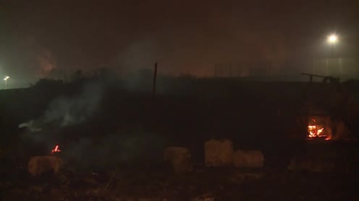 France: Calais refugee camp smoulders after massive blaze during eviction