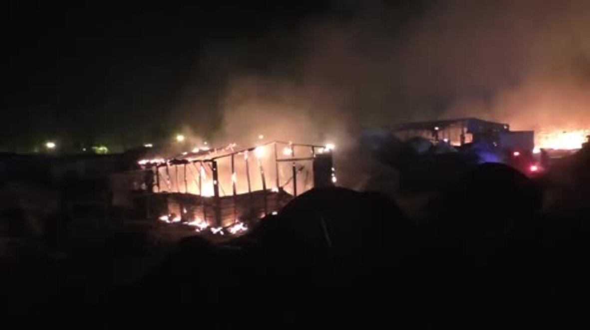 France: Emergency services arrive to quell fire at Calais refugee camp