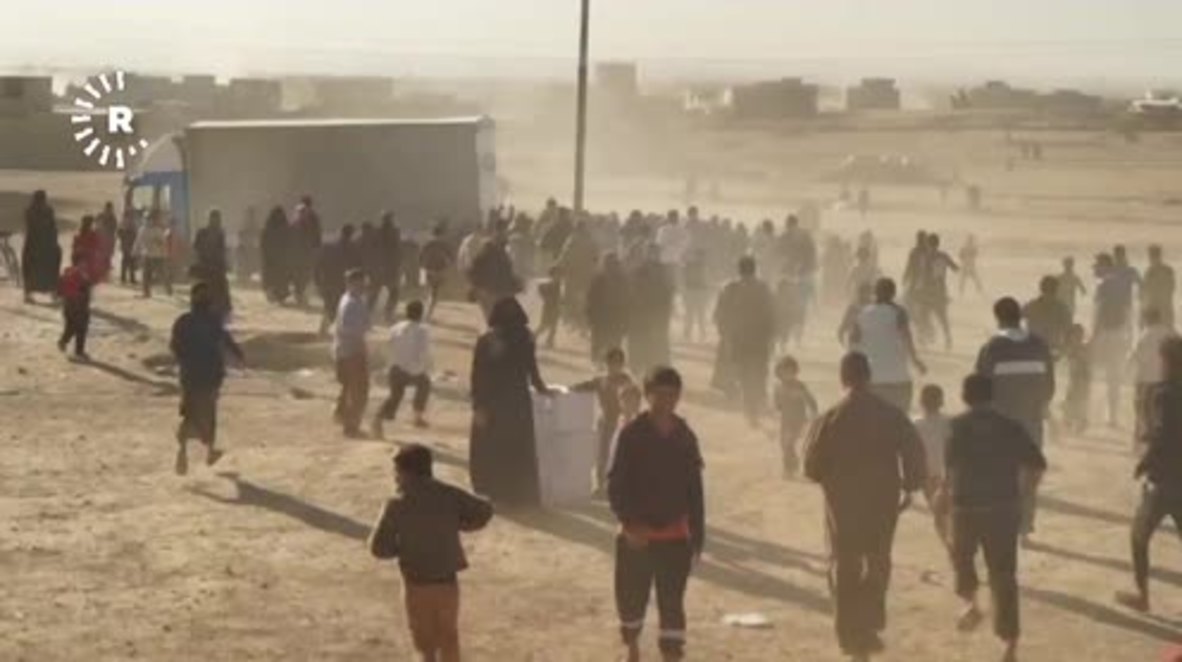 Iraq: Mosul food shortages leave soldiers struggling to contain crowds during aid delivery