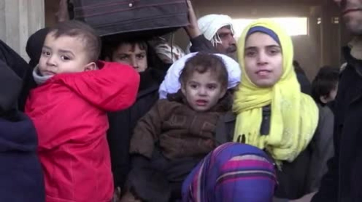 Syria: Liberated eastern Aleppo residents board buses to humanitarian centres