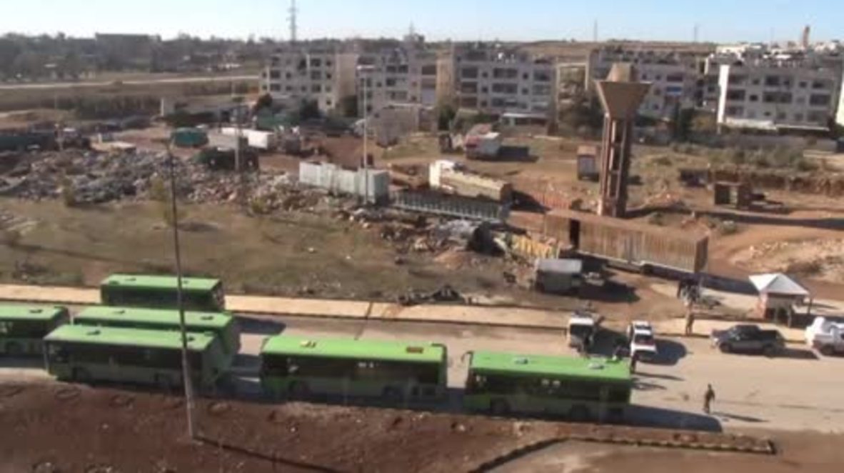 Syria: Aid workers and buses await evacuees in eastern Aleppo