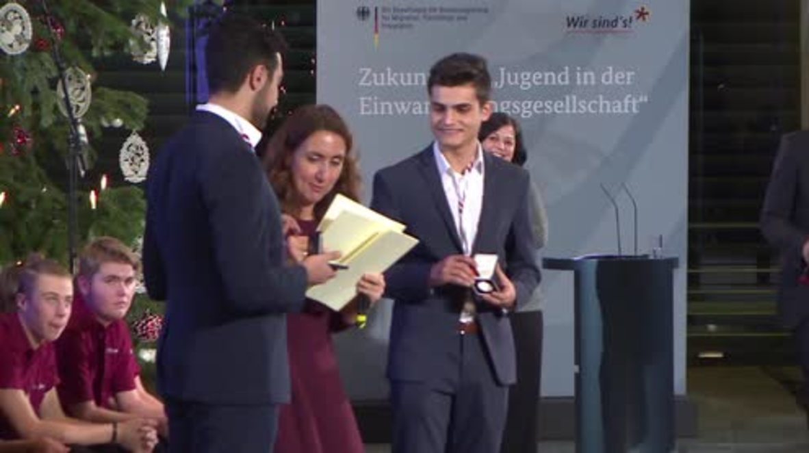 Germany: Merkel awards refugee integration activists at Chancellery