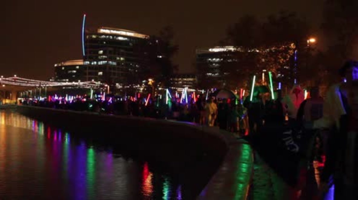 USA: Carrie Fisher fans hold light saber memorial march in Arizona