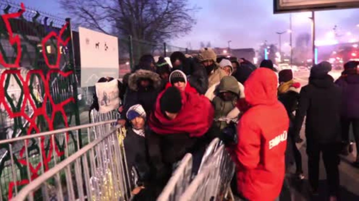 France: Refugees kept out in cold break past barriers to reach Paris reception centre