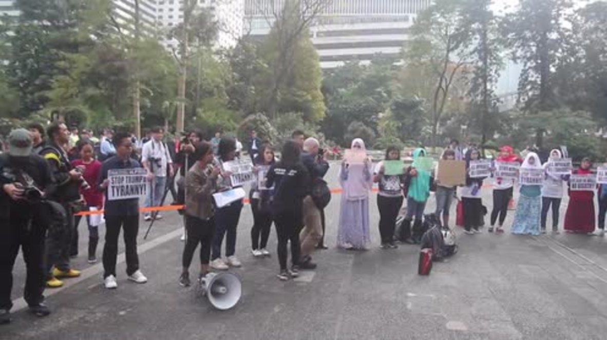 Hong Kong: Migrant workers protest in solidarity against Trump's travel ban