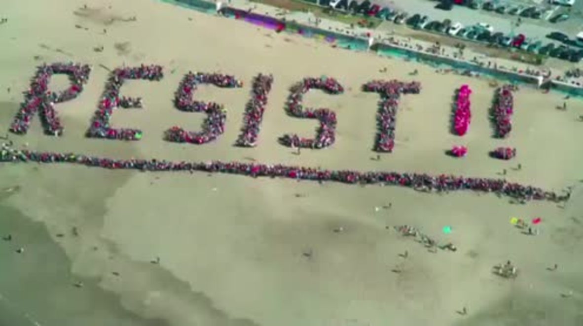USA: Anti-Trump protesters spell 'RESIST' on San Francisco beach