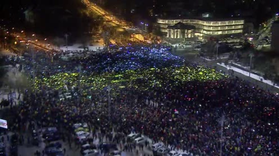 Romania: Protesters recreate massive Romanian flag on Victory Square