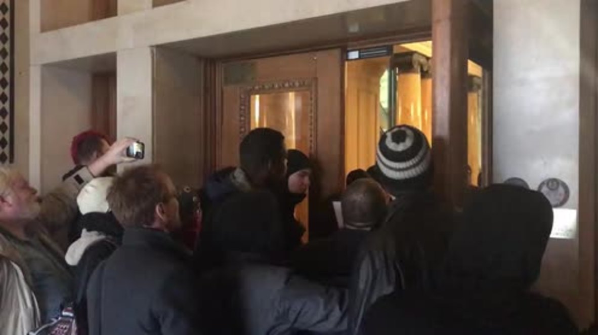 USA: Protesters storm Portland City Council calling for mayor's resignation
