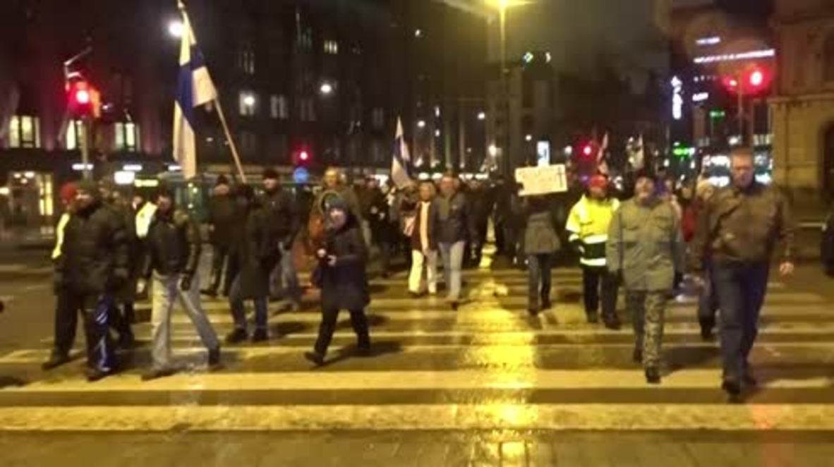 Finland: Anti-immigration protesters march past refugee camp in Helsinki