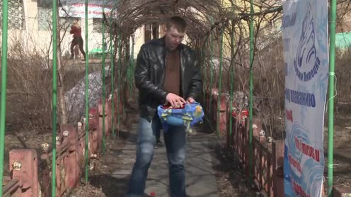 Russia: Brave ladies of Lipetsk hit freezing petal-scattered waters for Women's Day