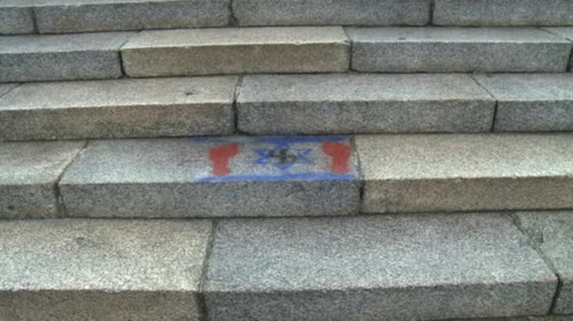Poland: Nazi and Jewish symbols graffitied on Soviet Military Cemetery in Warsaw