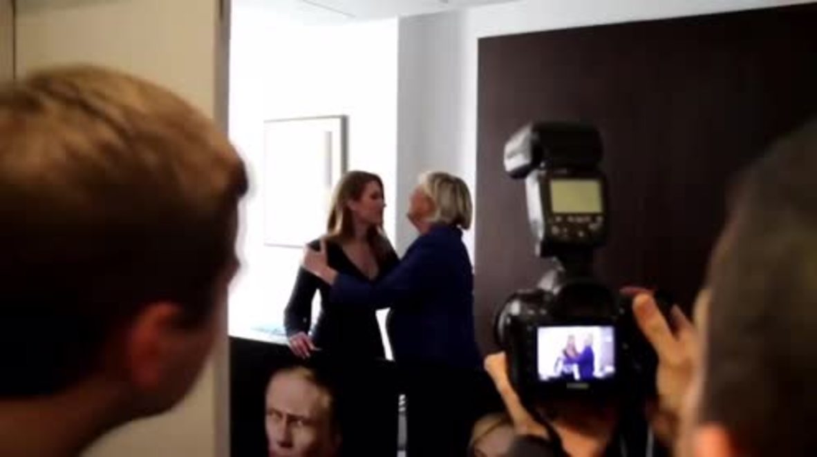 France: Russian activists present Le Pen with portraits of herself, Trump and Putin