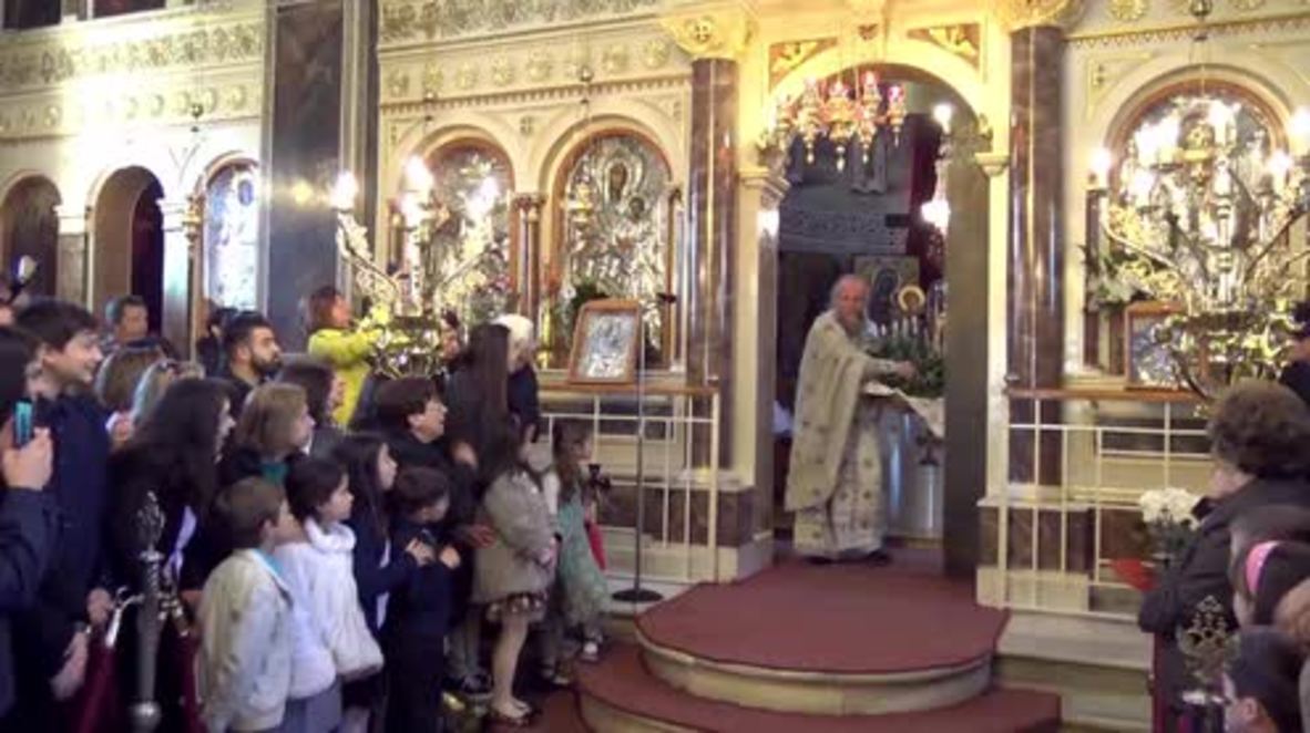 Greece: I'm so excited! Priest bursts out with bay-leafs at Easter sermon
