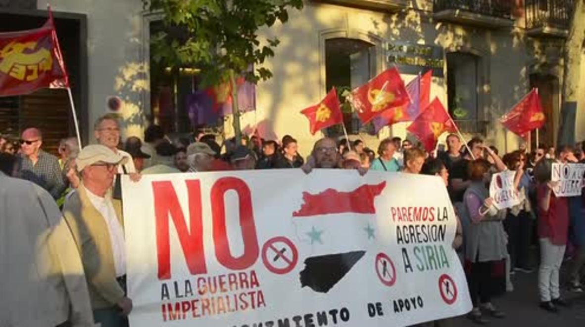 Spain: Leftists decry US 'aggression against Syria' outside embassy