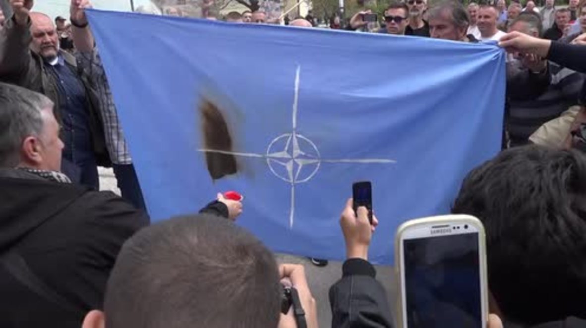 Montenegro: Protesters set fire to NATO flag, decrying govt's decision to join alliance