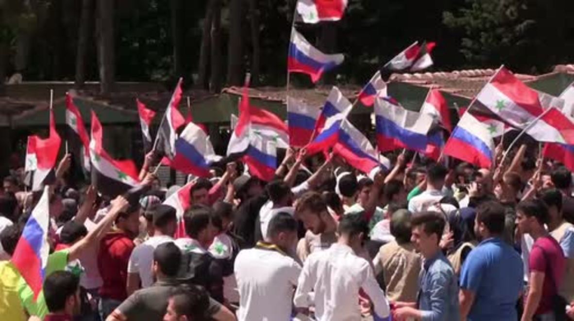 Syria: Aleppo residents wear St. George's ribbons in honour of Russia's V-Day