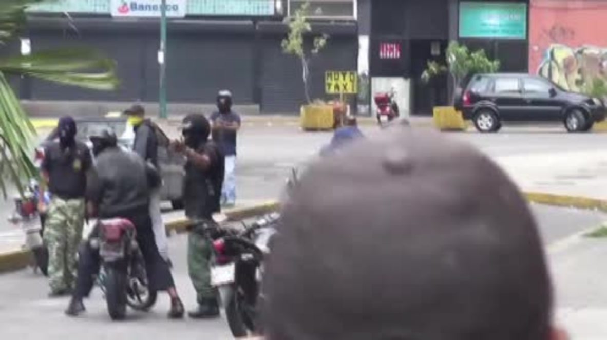 Venezuela: Armed gunman fires into crowd at protests in Caracas