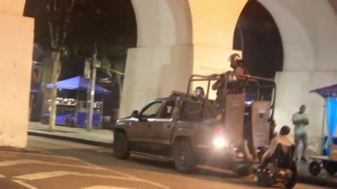Brazil: Riot police vehicle knocks over man in wheelchair amid clashes in Rio