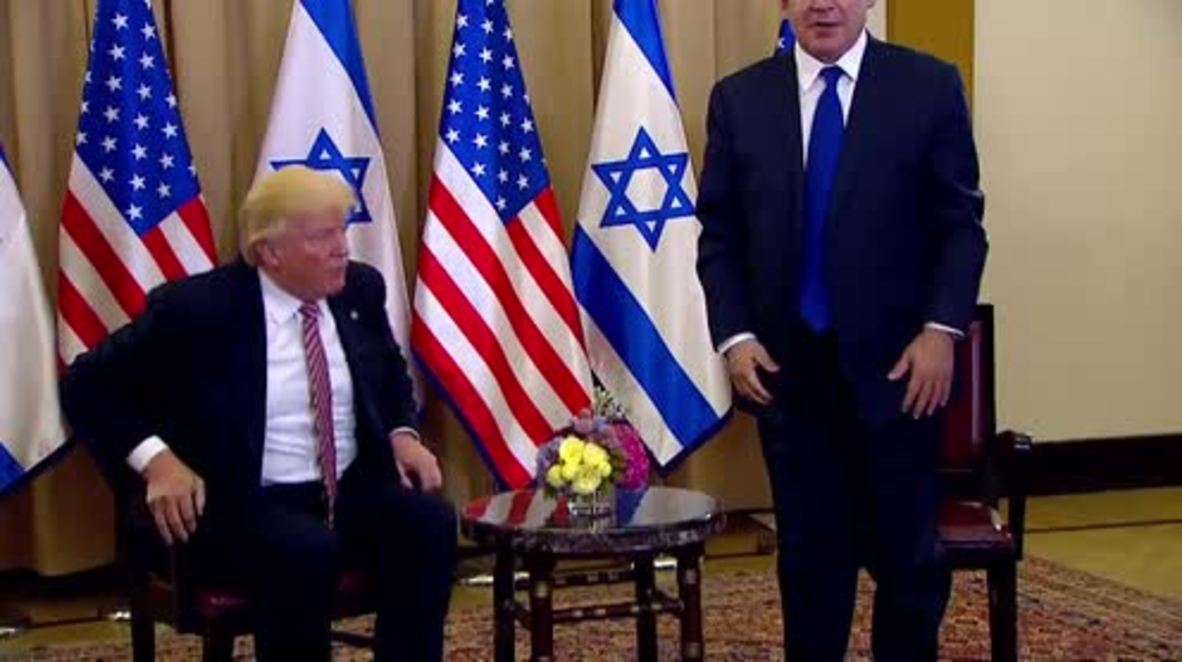 Israel: Second time's a charm! Trump shakes hands with Netanyahu after failed first attempt