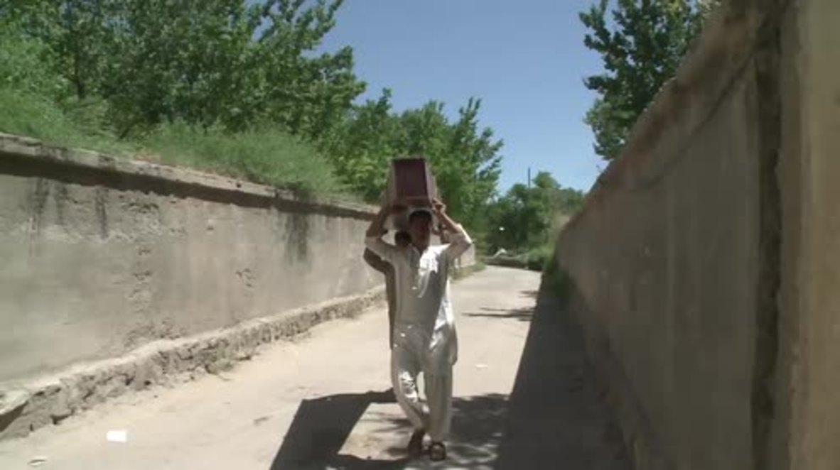 Afghanistan: Kabul bomb blast victims' families begin to bury their loved ones